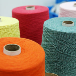 close up of different coloured rolls of yarn